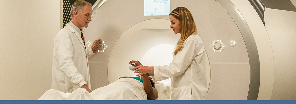 Investigators with a research participant in the 3 Tesla MRI scanner