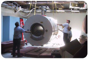 MRI scanner being lowered through roof hatch