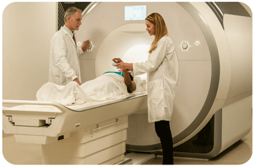 Researchers with research participant in Prisma MRI scanner