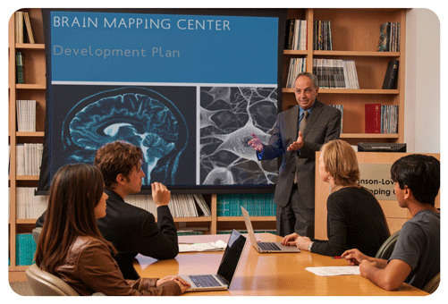 Dr. Mazziotta with others in Brain Mapping conference room