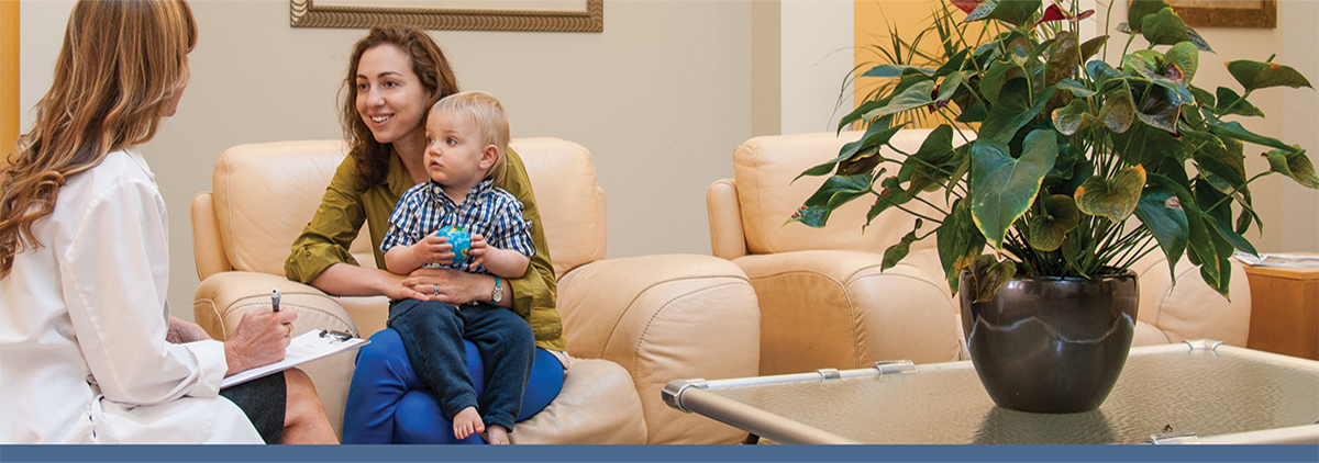 Researcher with woman and child
